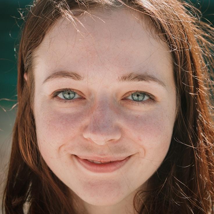 Avery Shah, Lead Design Curator at Global Trend Analytics, reviewing corporate floral arrangements